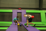 Two Boys Grabbing Dodgeballs at the Start of a Game